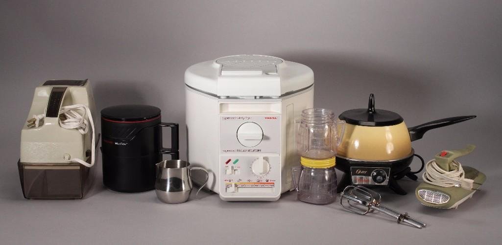 Kitchen Appliances (6): Oster electric fondue pot, Tefal super cool safety fryer (new), Farberware micro brew, Ostersnowflake ice crusher, hand blender, two Osterizer mini blend containers (one missing lid), and more.