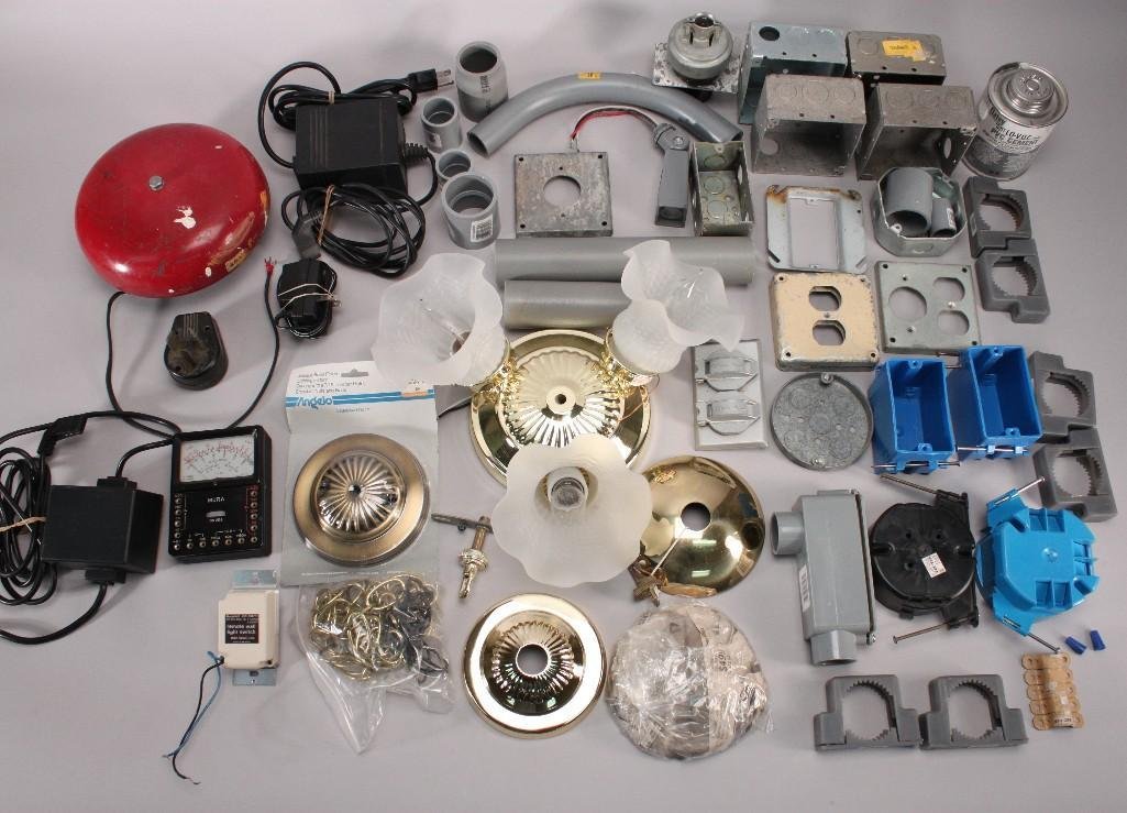 Electrician Supples: Handingantique brass finish light fixtures, junction boxes, rigid non metallic conduits, connectors, gray PVC cement, bell, Mura multi-meter, and more.