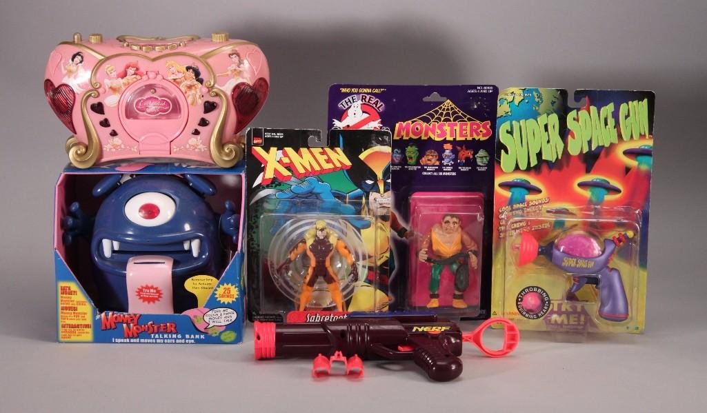Vintage Action Figures & Kids Toys (6): Money Monster talking/animated piggy bank NIB, 1998 Marvel Comics X-Men Sabertooth action figure, 1986 The Real GhostbustersThe Quasimodo monster action figure, Super Space Gun, and more.