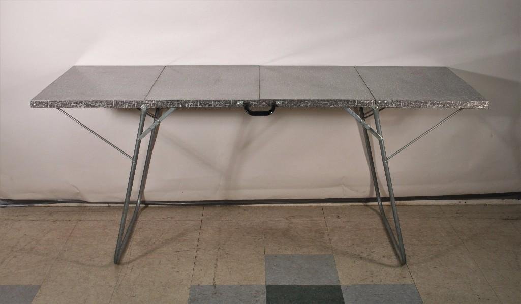 Vintage Portable Folding Table: Metal folding tablemeasures 36" x 30.5" when collapsed and 72" x 30.5" when open, good condition.