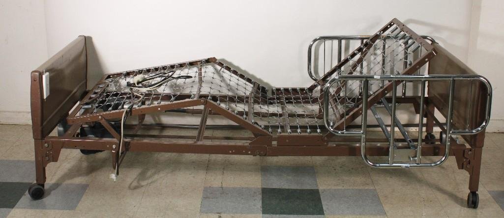 Invacare Fully Electric Hospital Bed: Model no 6630, mattress not included, includes both metal bed rails, remote control, and power cord, in good used condition.