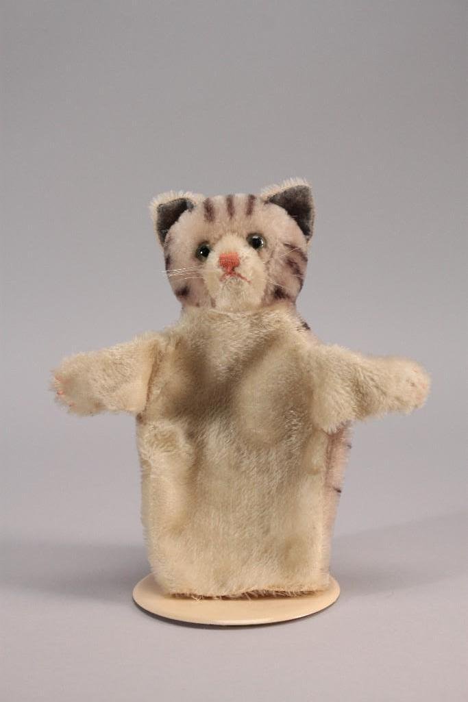 Steiff Cat Puppet: 9" long striped mohair cat puppet with green glass eyes and pink stitched nose, good condition, no Steiff metal button or cloth label.