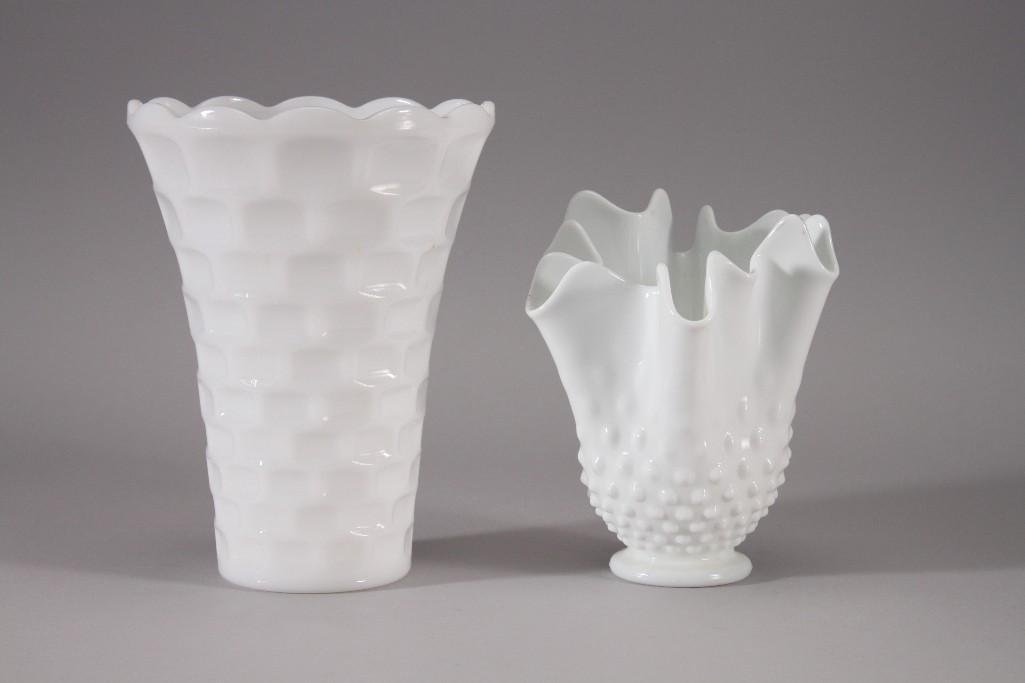 Decorative Milk Glass Vases (2): Handkerchief design hobnail milk glass vase stands 7" tall and a 8" tall milk glass vase. Both items are in good pre-owned condition.