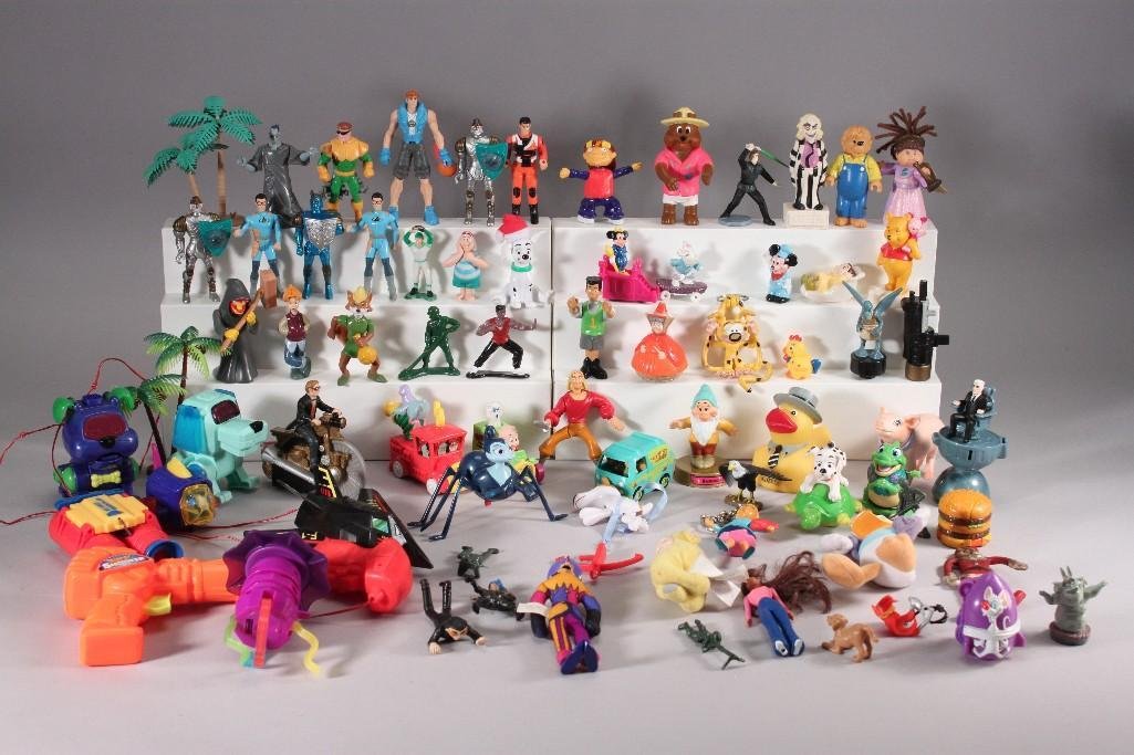 Vintage Kids Meal Toys: Toys include Woody, Beetle Juice, 101 Dalmatians, F117A remote controlled battery operated airplane, kids meal toys, two 2002 Poochie Friends dogs, plastic gun, Teletubbies, Doug (patty), Simpsons, Mi