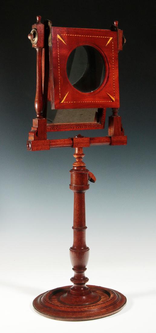 A 19THC MAHOGANY ZOGRASCOPE WITH INLAID DECORATION: An interesting and nicely constructed Victorian contraption with fine wood inlays, the moveable mirror and lens worked in tandem and along with the telescoping adjustment option of the stand to enable
