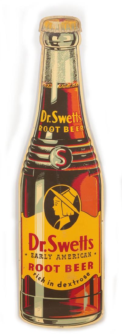A GOOD DR. SWETTS ROOT BEER DIE CUT BOTTLE SIGN: A nice new old stock die cut tin sign for Dr. Swetts Root Beer, a bottle form flat sign circa late 1940s. Measures 44.5 x 12.25 inches. We happily provide seamless in-house packing and shipping servic