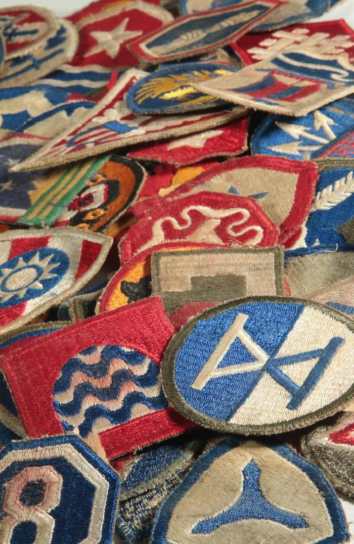 A COLLECTION OF 105 WWII-ERA US ARMY PATCHES: A collection of 104 cut edge patches for WWII-era US Army corps, including 15 Airborne, 11 Armored, an old style Tank Destroyer, a good bullion CBI China Burma India, TC MTS Red Ball Express, printed