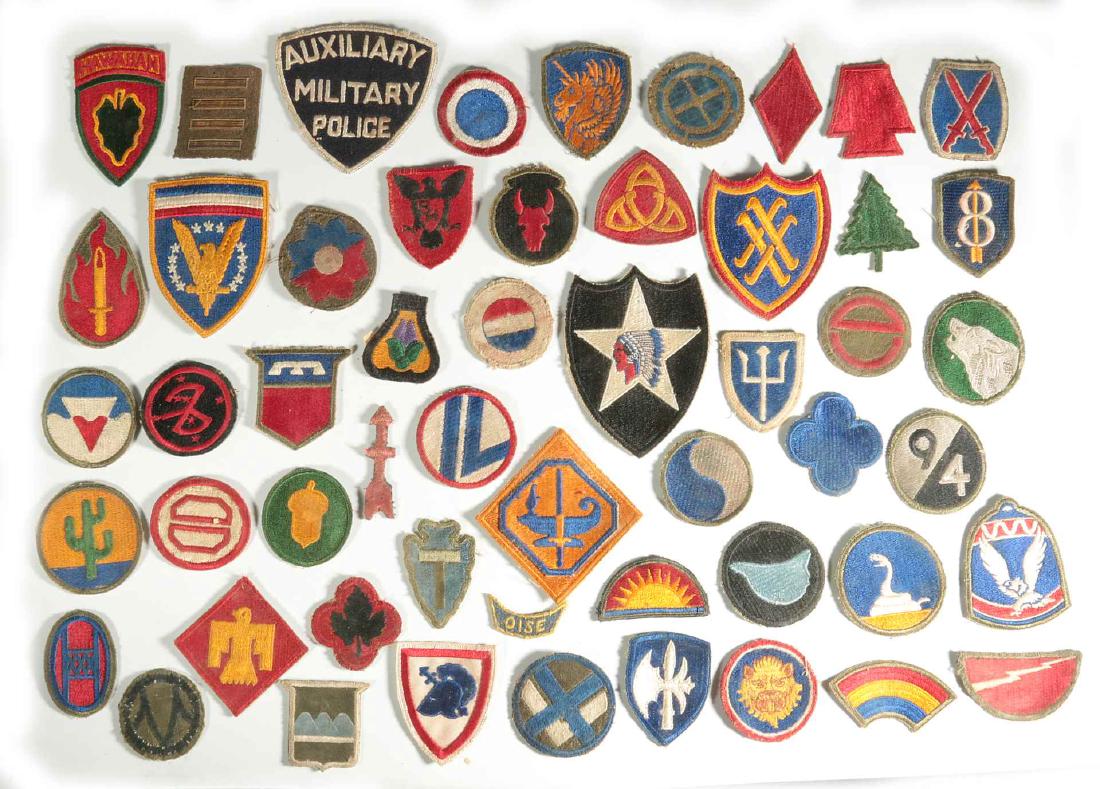 A COLLECTION OF 102 WWII-ERA US ARMY PATCHES: A collection of 102 cut-edge patches for divisions, armies, and commands. Includes Big Red One, 1st and 2nd cavalry, Aux MP, 2nd Div., Thunderbird, 34th div. and many more. Includes eight pieces of WW