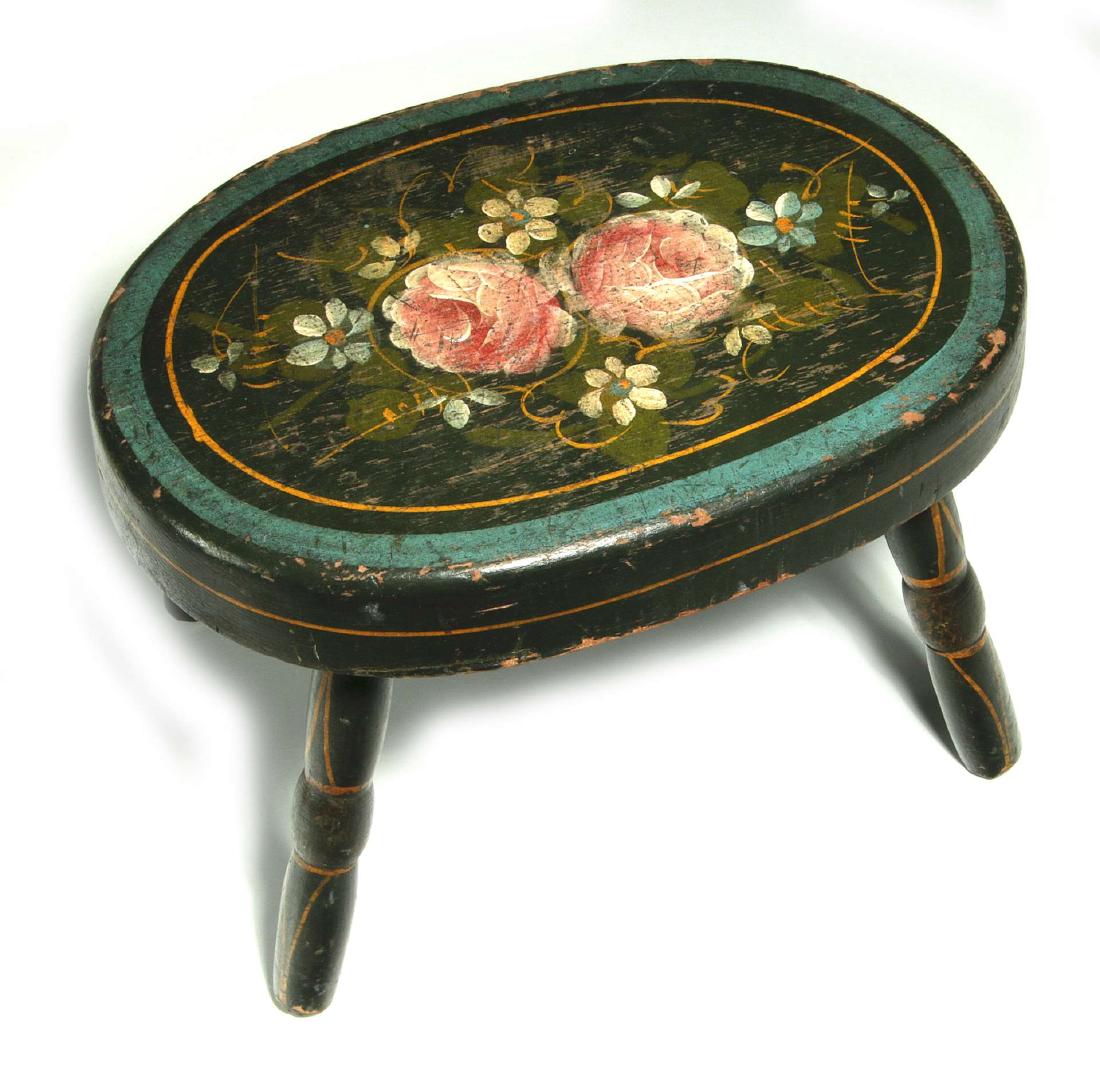 NICE 19C CRICKET STOOL W/ORIGINAL PAINT DECORATION: A thick oval wood top, original floral decoration centering a blue band on black ground embellished with ochre pin striping, four similarly decorated turned legs. Measures 9 x 12 x 8 inches. We happil