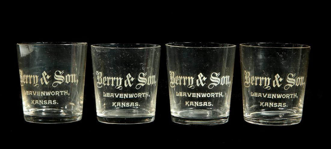 FOUR BERRY & SON LEAVENWORTH, KANSAS SHOT GLASSES: Four pre-prohibition era shot glasses from an early western Kansas river town. Measure 2.25 x 2 inches each. We happily provide seamless in-house packing and shipping services on nearly everything we 