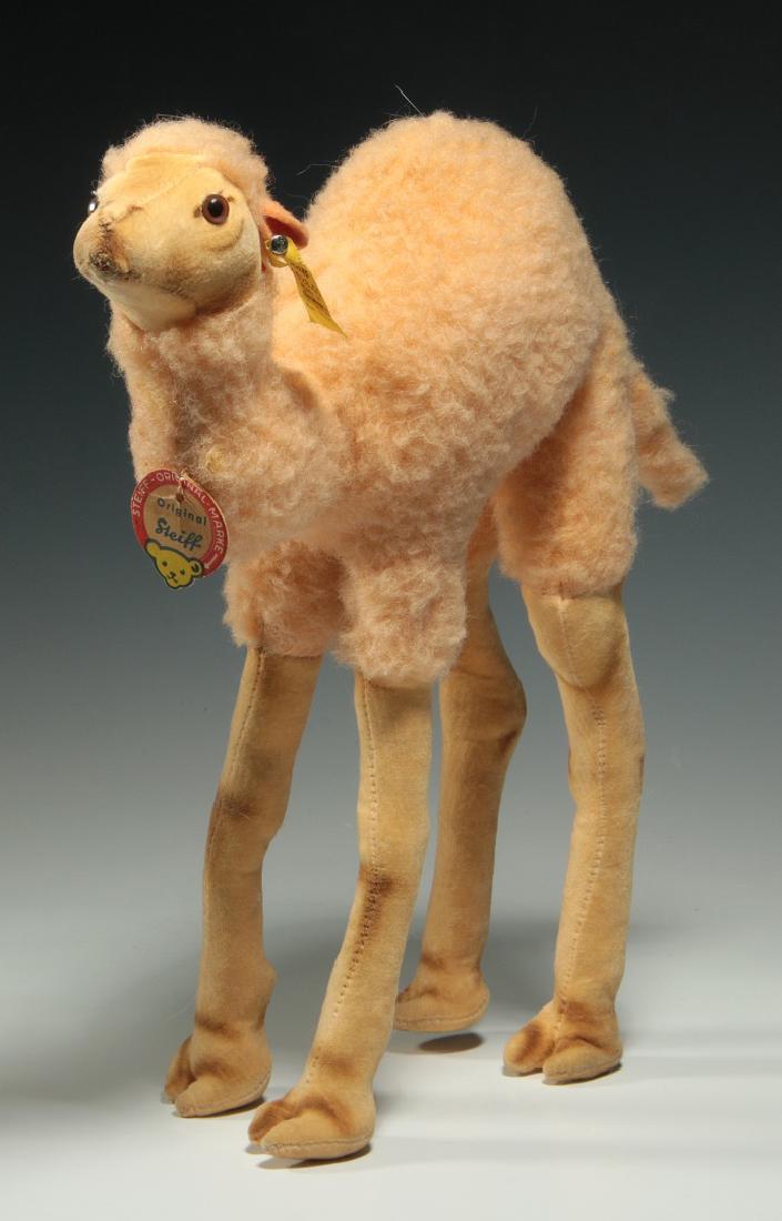 A STEIFF CAMEL PLUSH TOY: Circa 1950's, paper tag and chrome script button. Measures 11 x 11 inches. We happily provide seamless in-house packing and shipping services on nearly everything we sell.