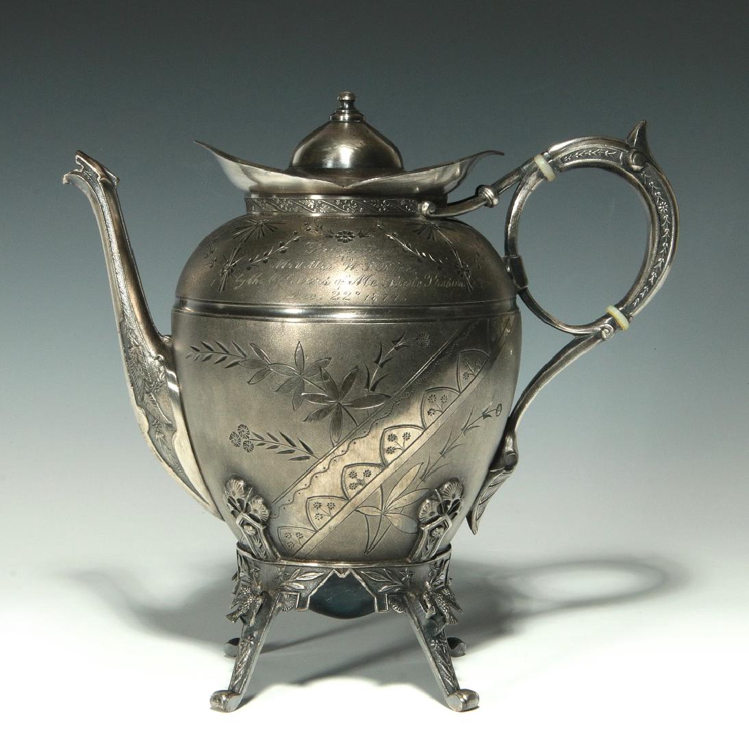 AN 1874 PRESENTATION FROM OFFICERS ME STATE PRISON: A Victorian quadruple plate footed coffee pot, hand engraved Aesthetic Movement designs, a hand engraved inscription on the rounded shoulder of the pot reads, 'Presented to Mr. and Mrs. W.P Price by t