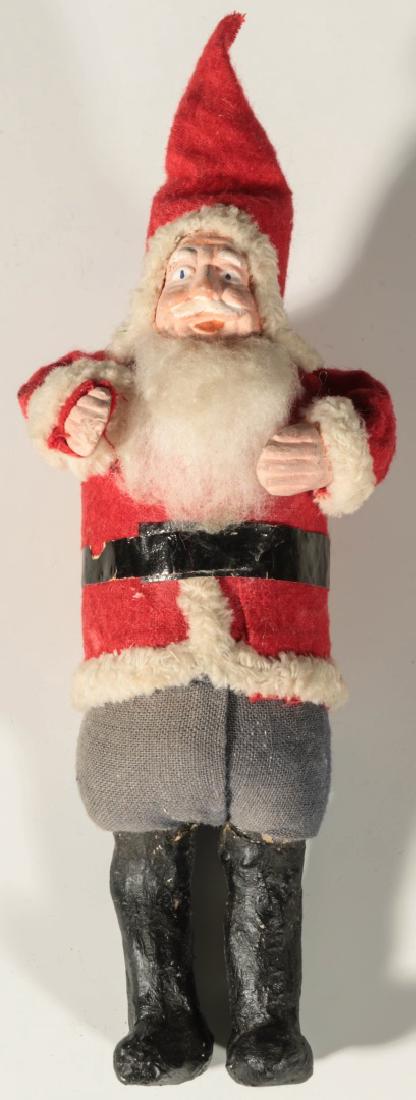AN EARLY 20TH C. SANTA FIGURE: A felt and cotton Santa Claus figure with composition face, hands and boots. Probably Japanese circa 1930. Measures 6 inches tall. We happily provide seamless in-house packing and shipping services on