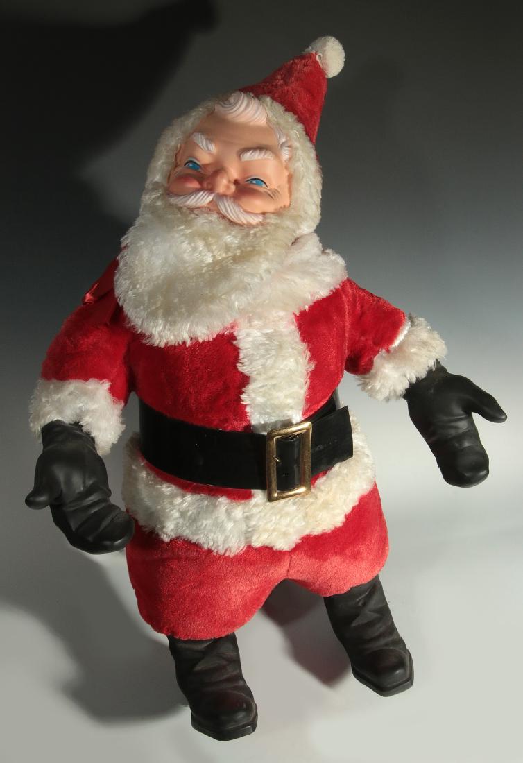 A 30--INCH VINTAGE SANTA CLAUS FIGURE: A plush figure with molded rubber face, rubber mittens and boots. Measures 30 x 22 inches. We happily provide seamless in-house packing and shipping services on nearly everything we sell.