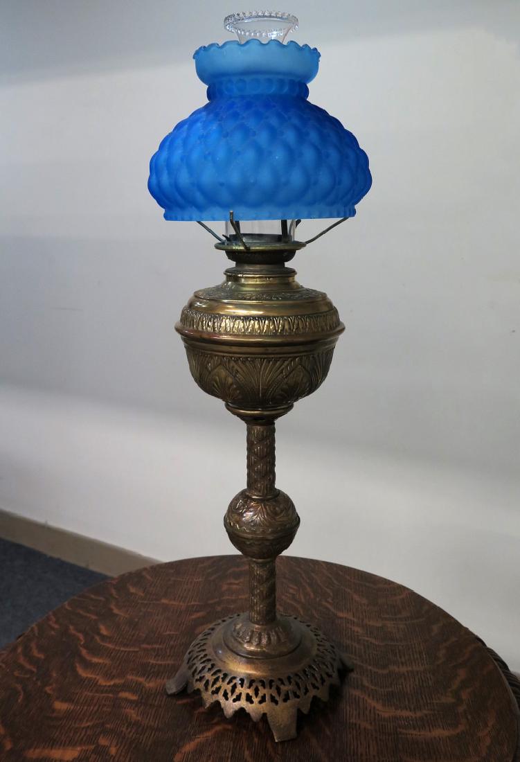 A 19TH C. BRASS OIL LAMP WITH BLUE QUILTED SHADE (1 of 5)