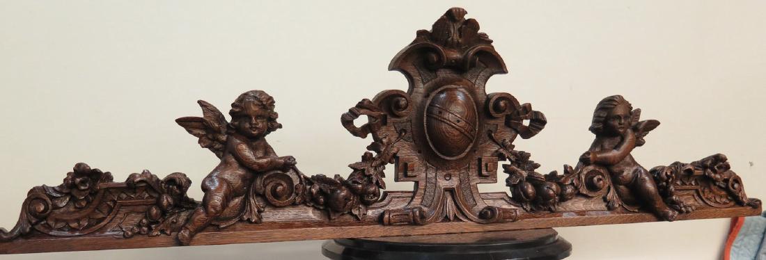 RJ HORNER QUARTERSAWN OAK HEAVILY CARVED PUTTI CREST (1 of 2)