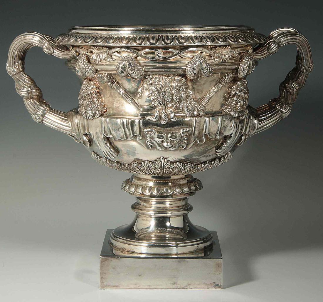 A NICE QUALITY WARWICK VASE WINE COOLER CIRCA 1900: A nice quality early 20th century silver-plate Warwick Vase form wine cooler of campana form flanked by intertwining reeded grapevine handles, the body decorated in acanthus leaves and Bacchic masks o