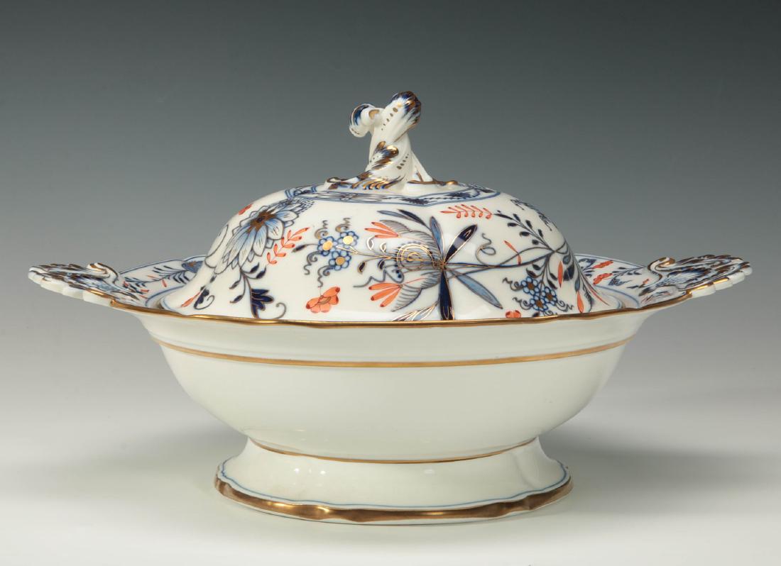 A MEISSEN BLUE ONION WITH RED BUD COVERED DISH: A rare variation on the Meissen 'Blue Onion' pattern typically found in blue only; this 19th century example being an ornate form with the standard blue on white embellished with orange and red highli