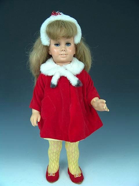 1961 CHATTY CATHY DOLL IN ORIG FUR TRIM JACKET: Blonde hair, blue eyes, garbled voice box, freckes, teeth etc all intact. Working sleep eyes. 19 inches.