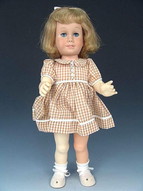 COPYRIGHT 1960 CHATTY CATHY DOLL: Blonde hair, blue eyes, full freckles and eye brows, sqeeky voice box. Good condition overall. Working sleep eyes. 19 inches