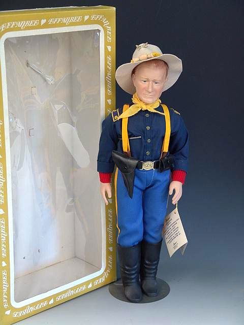 EFFANBEE JOHN WAYNE DOLL IN ORIGINAL BOX: Complete with original hat, gun & holster. Measures 18 inches high. Good complete condition. The box show light soiling and tape residue.