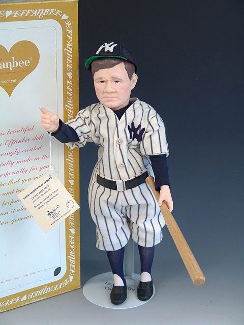 EFFANBEE BABE RUTH DOLL IN ORIGINAL BOX: Like new condition complete with hat, bat and wrist tag. Measures 15.5 inches tall. Box shows light soiling and tape residue.