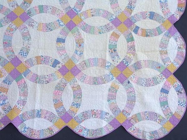 DOUBLE WEDDING RING HAND STITCHED QUILT: Measures 64 x 94 inches.