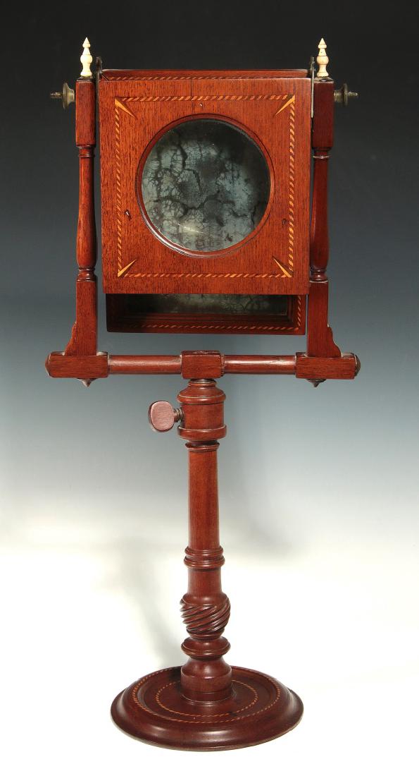 A 19THC MAHOGANY ZOGRASCOPE WITH INLAID DECORATION: An early 19th century mahogany zograscope or optical diagonal machine. These table-top devices were used for viewing 'Vue d'optique' hand colored engravings sometimes called Perspective Views. The per