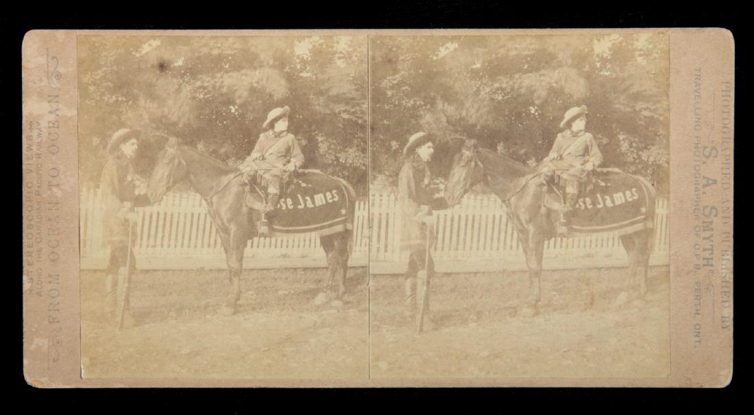 A STEREOVIEW OF MRS. JESSE JAMES AND TEXAS CHARLIE: Photographed and Published by S. A. Smyth. A Sharpshooting Act in the 1880s, Mrs. James being the shooter. From an article about her death in the South Amboy (NJ) Citizen. 'Papers, letters and telegra