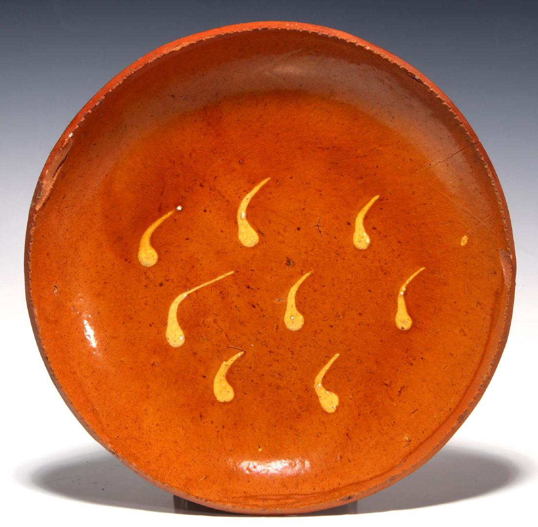 A SLIP DECORATED 19TH CENTURY REDWARE PLATE (1 of 10)