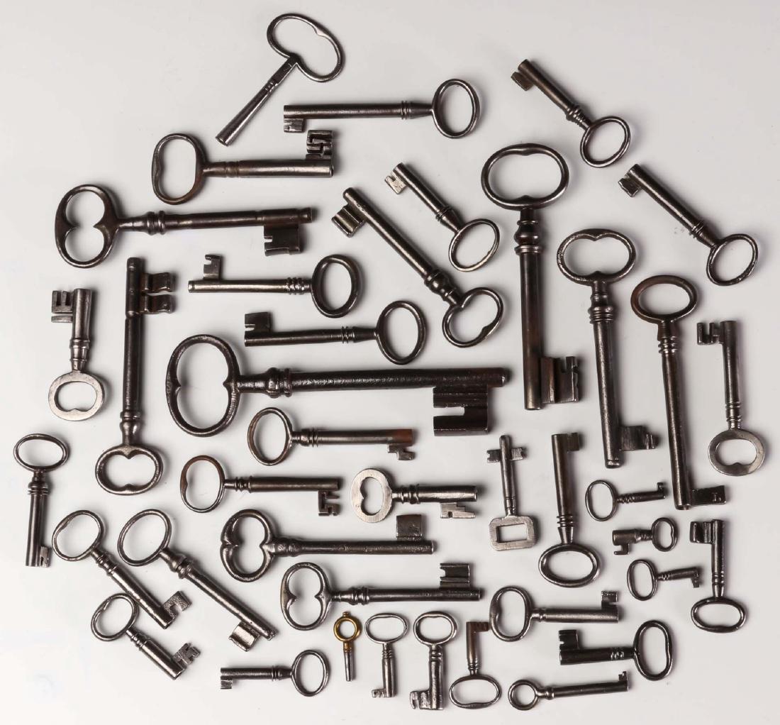 FORTY MISCELLANEOUS 19TH CENTURY KEYS: Includes mainly smaller clock or small door keys, average 2.25 inches, plus a good amount of cabinet or door size keys, average 4.25 inches. We happily provide seamless in-house packing and shipping s