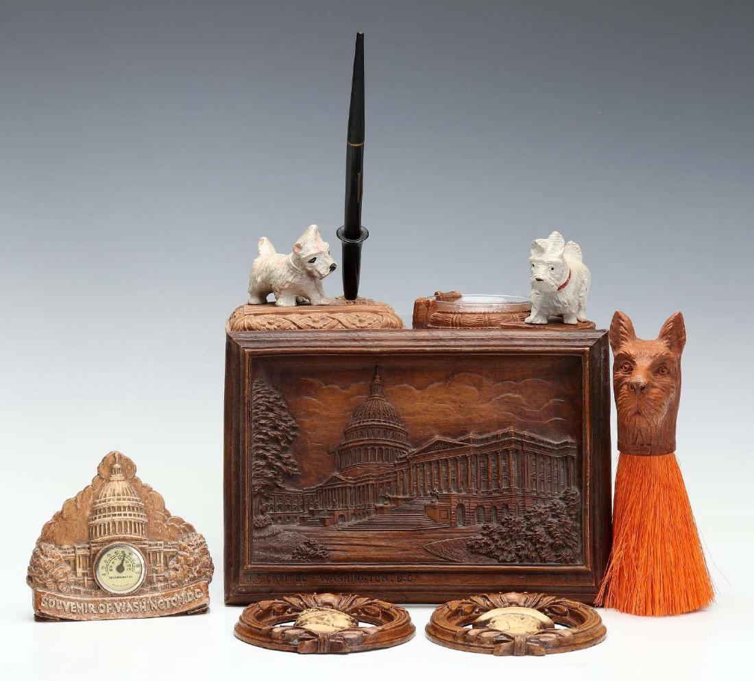 A COLLECTION OF SYROCO WOOD ITEMS: Seven mono- and polychrome items by The Syracuse Ornamental Company include a thermometer, pen holder, ashtray, shaving brush and three plaques. Circa mid-20th century, unmarked. The sizes range from 