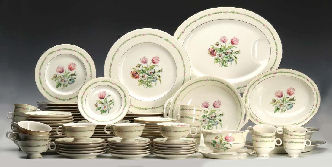 THEODORE HAVILAND 'GARDEN FLOWER' SERVICE FOR 12: Included are Cup and saucer sets, salad plates, bread and butter plates, dinner plates, gray boat, open vegetable round, two oval open vegetables. Twelve 10.5 inch dinner plates, eighteen 7.5 inch sal