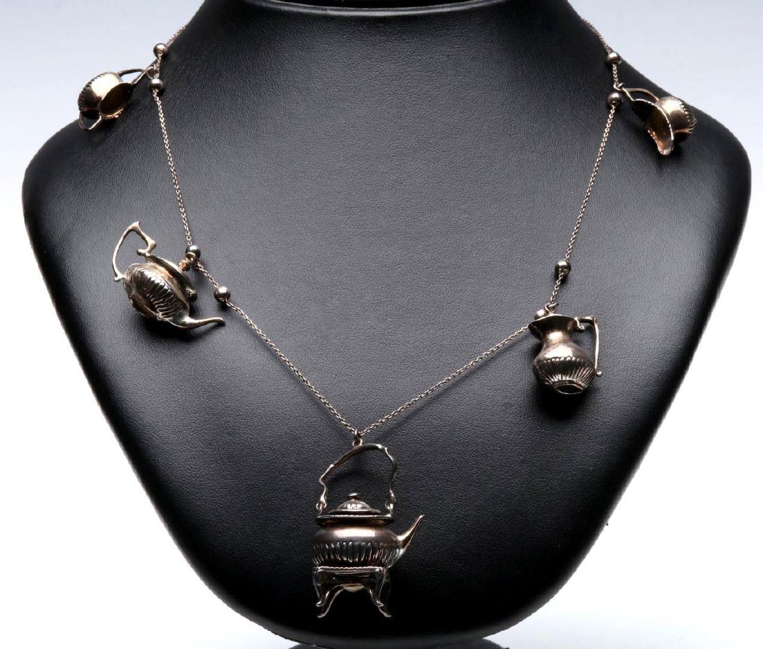 A STERLING SILVER NECKLACE WITH TEAPOT CHARMS (1 of 6)