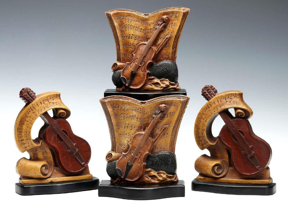 TWO PAIR SYROCO WOOD BOOKENDS WITH VIOLINS: Circa mid-20th century, polychrome composite wood bookends by The Syracuse Ornamental Company marked under with bases with foil labels. Measure 7.5 x 6 x 2 inches. Minor overall wear, no chips or repa