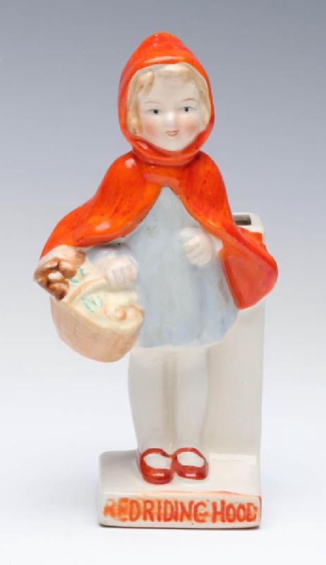 CIRCA 1920S 'RED RIDING HOOD' TOOTHBRUSH HOLDER: Unsigned, measures 5.5 x 2.75 inches. We happily provide seamless in-house packing and shipping services on nearly everything we sell.