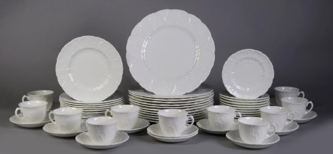 'COUNTRYWARE' FINE BONE CHINA SERVICE: A 58 piece set includes: twelve dinner plates twelve salad plates, eleven bread and butter plates, eleven tea cups and twelve saucers. Manufactured by both Coalport and Wedgwood, there is no distingui