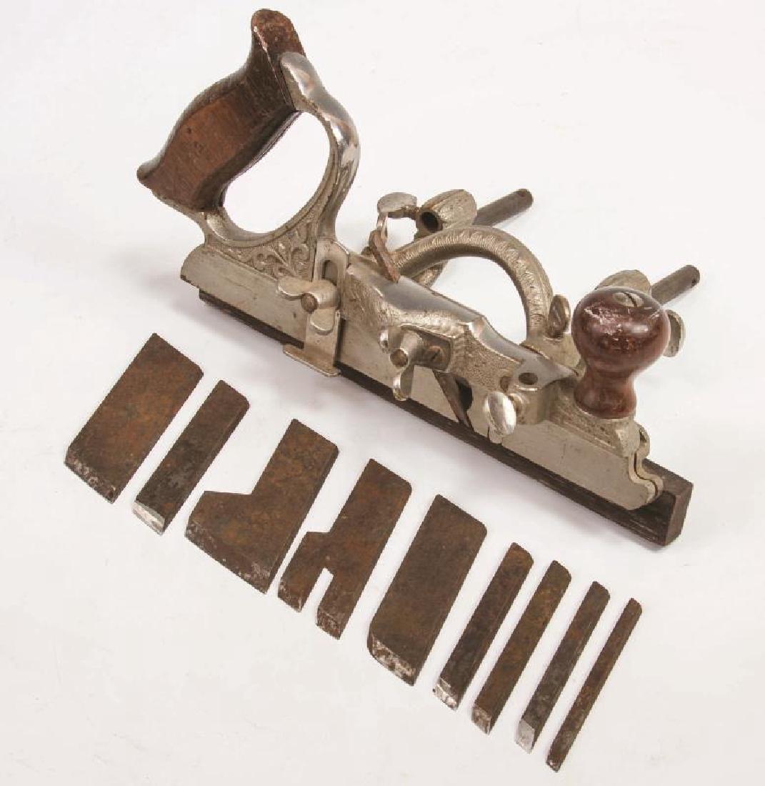 A STANLEY NO. 46 SKEW CUTTER PLANE WITH CUTTERS: A combination plow plane complete with all ten cutter blades. Measures 5 x 11 x 6.5 inches. We happily provide seamless in-house packing and shipping services on nearly everything we sell.