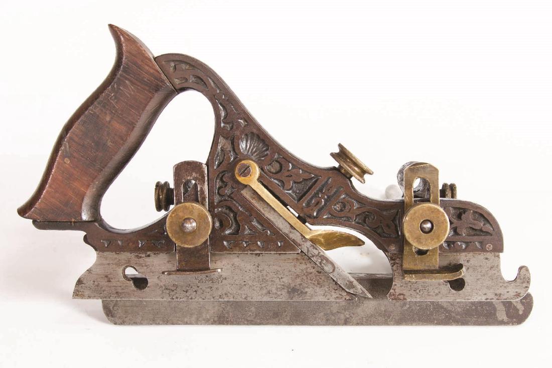 A STANLEY NO. 41 ADJUSTABLE PLOW PLANE: A Miller's Patent adjustable plow plane manufactured 1871 to 1897, with an adjustable fence and depth stop, Measures 6 x 6.25 x 10.5 inches. We happily provide seamless in-house packing and shipping s