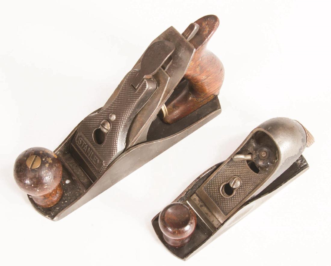 A STANLEY NO. 203 BLOCK PLANE AND, NO. 2 SMOOTH: Includes a no. 203 Sweetheart block plane, and a no. 2 smooth plane with a hole drilled through the sole and wrong lever cap, usable or for parts. Measures 5.5 and 7 inches. We happily provide seamles