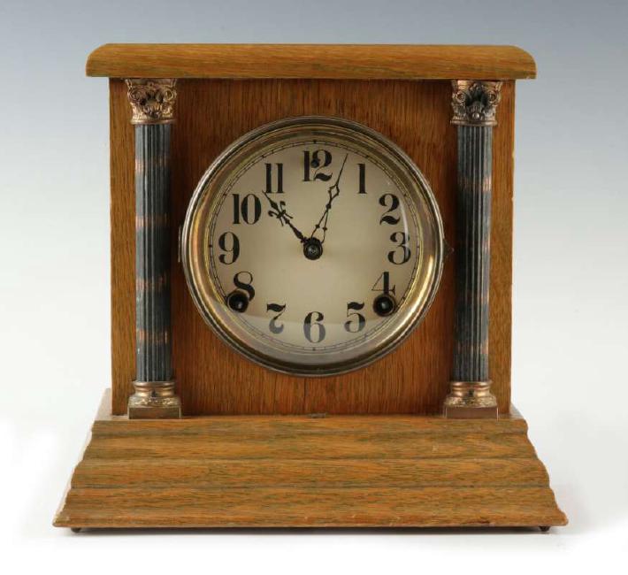 A SMALL SESSIONS CABINET CLOCK