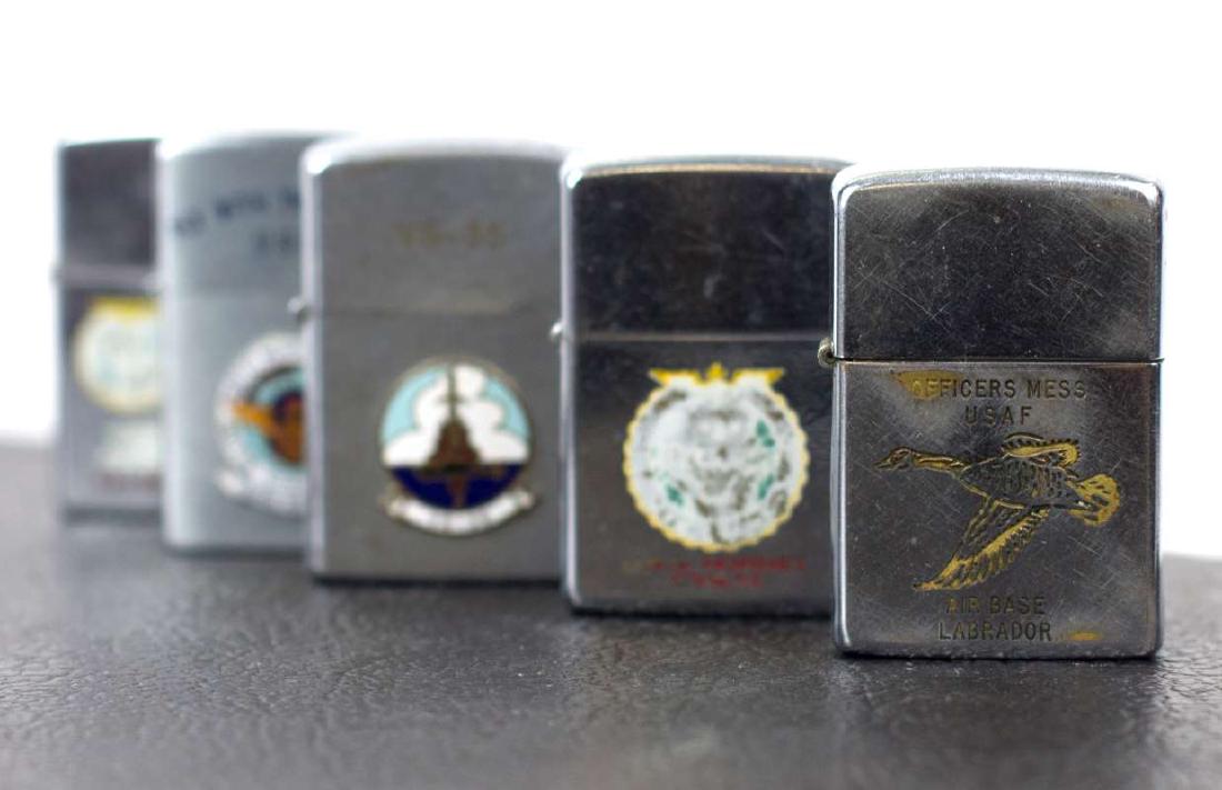 A GROUP OF TWELVE MILITARY THEME ZIPPO LIGHTERS (1 of 6)