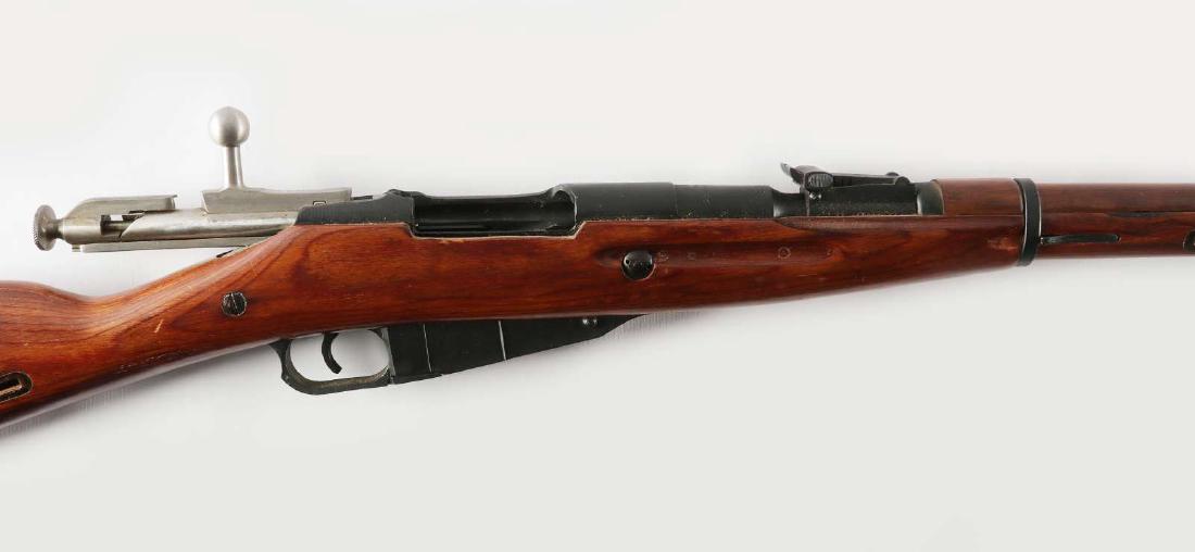 RUSSIA M1938 MOSIN NAGANT CARBINE: Serial number TM 8333, bolt matches, magazine bottom plate and butt plate have been arsenal renumbered.98% blued finish rifle has a been arsenal reworked, laminated stock and cleaning rod. We happily 