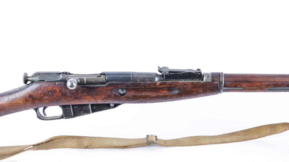 RUSSIAN M91/30 MOSIN NAGANT RIFLE WW2: Serial number PI 3376, manufacture by Tula 1939 caliber 7.62x54R, Finnish capture proofs, receiver, barrel, bolt and floor plate are matching numbers, butt plate is mismatched. 70% original, finish, t