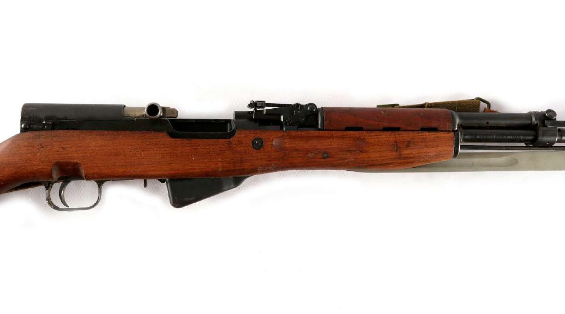 YUGOSLAVIA M59/66 'SKS' TYPE SEMIAUTO RIFLE: Serial number F168018, matching numbers on receiver, 7.62x39 caliber, bolt carrier, trigger guard and stock, built in rifle grenade launcher and sights plus folding blade bayonet, complete and functio