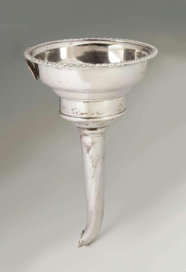 A GEORGIAN OLD SHEFFIELD PLATE SILVER WINE FUNNEL: Of two-piece construction, a simple gadrooned edge, side handle, typical form. Measures 5.5 x 3.25 inches. We happily provide seamless in-house packing and shipping services on nearly everything we se