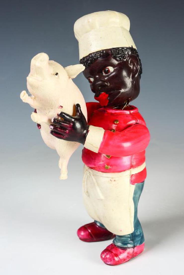 A CIRCA 1930 CELLULOID TOY BLACK CHEF WITH PIG (1 of 10)