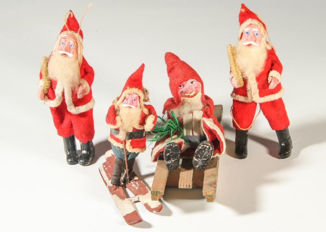 A COLLECTION OF FOUR CA. 1920 SANTA CLAUS FIGURES (1 of 10)