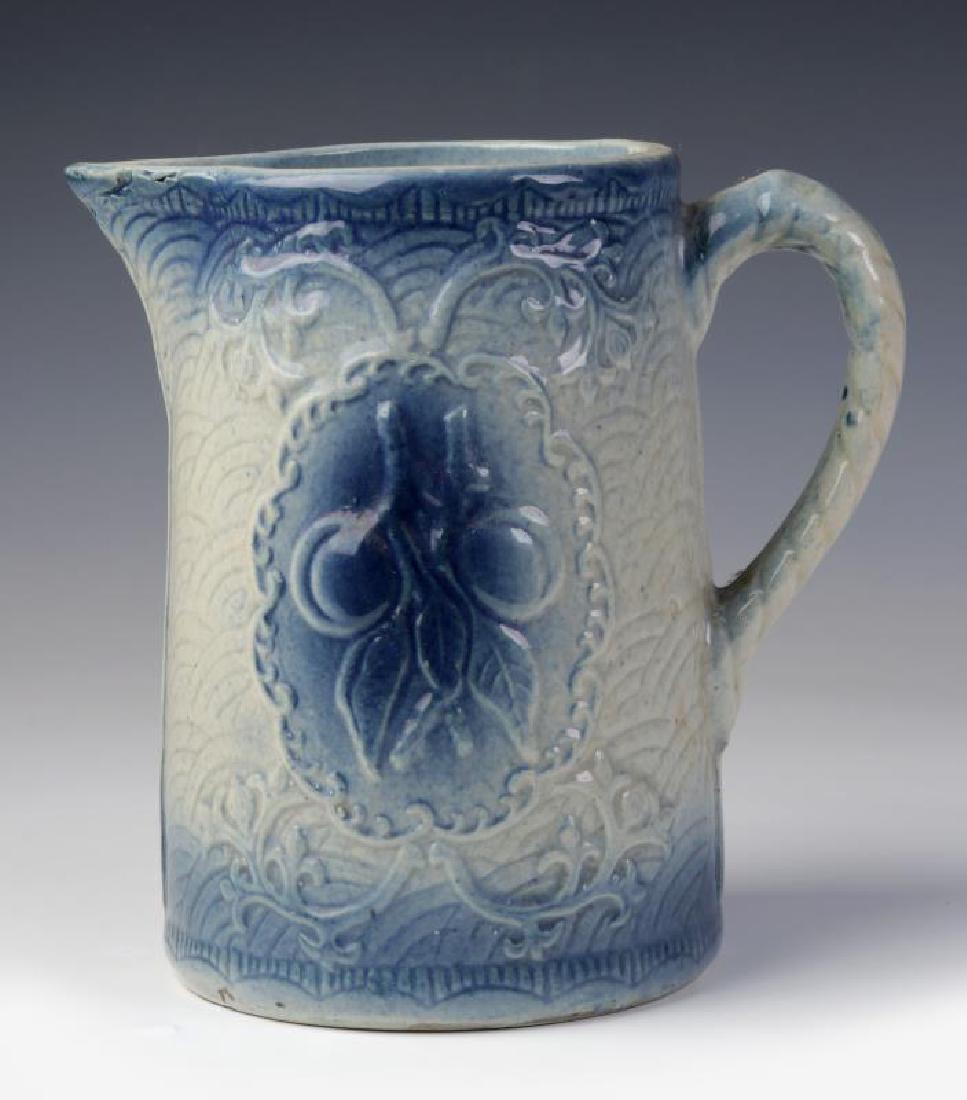 A BLUE AND WHITE STONEWARE PITCHER WITH CHERRIES (1 of 9)