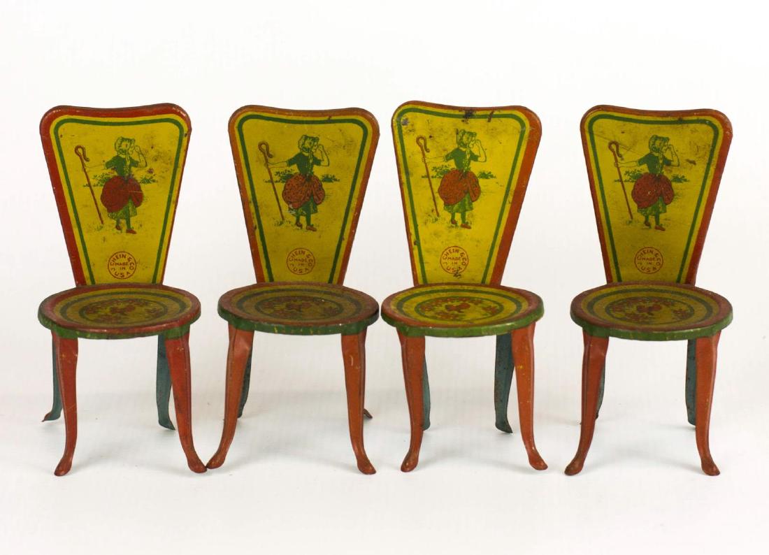 FOUR J. CHEIN & CO. TIN LITHO DOLL CHAIRS: Four matching chairs with a Little Bo Peep theme, signed on the chair backs. Measure 4.5 x 2.25 inches each. We happily provide seamless in-house packing and shipping services on nearly everything we 
